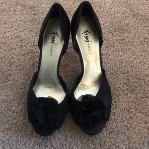 Black high heels with flower on toes